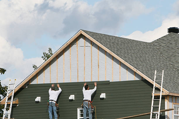 Professional Siding technician working in Collins, OH